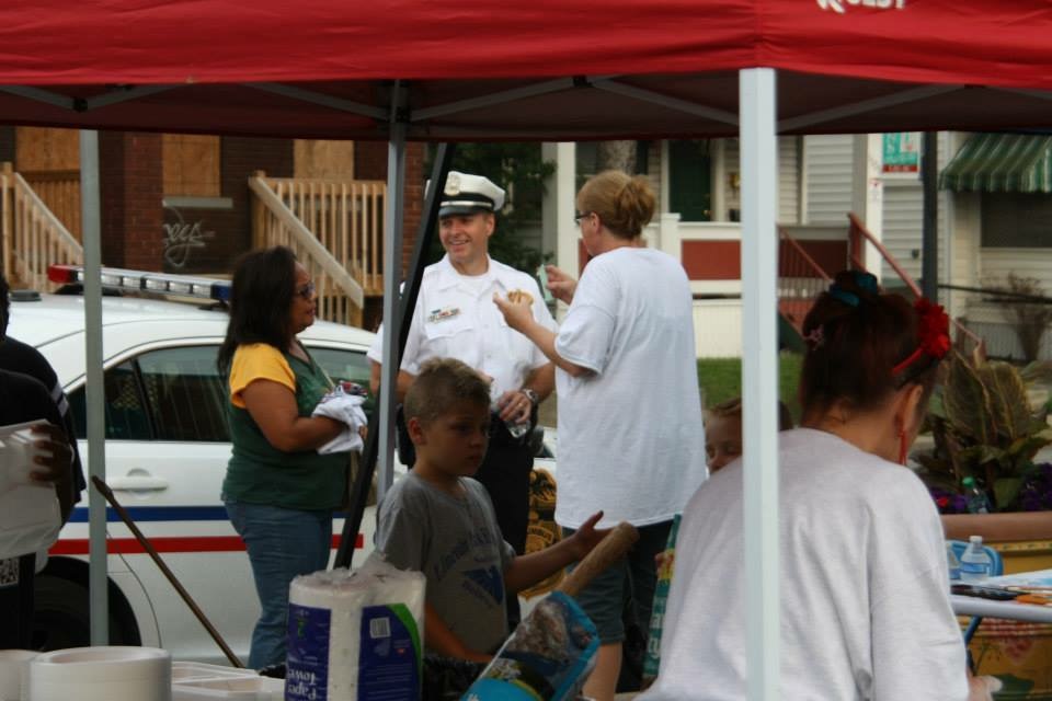 Sherri (right) talking with the local police at one of the many community block watch events .